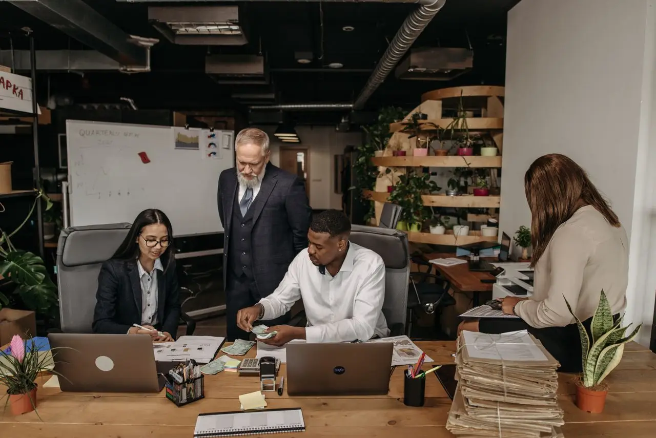 employees drawing in paperwork during end of tax season